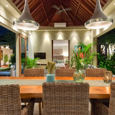 Eshara II – Dining table at night Villa Eshara Complex - Villa Gallery