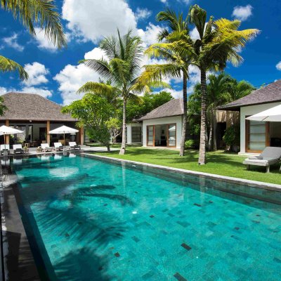 Villa Tiga Puluh Villa Tiga Puluh, a modern tropical villa featuring a private pool, open-air living spaces, lush gardens, and Balinese-inspired architecture for a relaxing stay.
