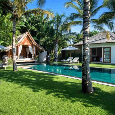 Villa Tiga Puluh Villa Tiga Puluh, a modern tropical villa featuring a private pool, open-air living spaces, lush gardens, and Balinese-inspired architecture for a relaxing stay.