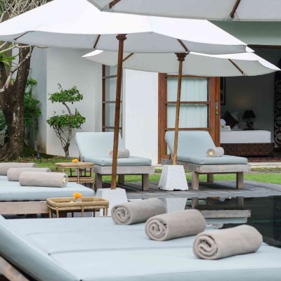 Villa Tiga Puluh Villa Tiga Puluh, a modern tropical villa featuring a private pool, open-air living spaces, lush gardens, and Balinese-inspired architecture for a relaxing stay.