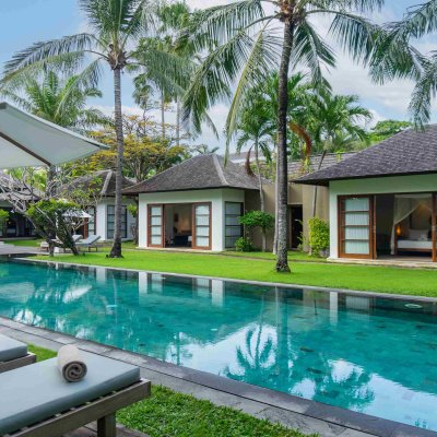 Villa Tiga Puluh Villa Tiga Puluh, a modern tropical villa featuring a private pool, open-air living spaces, lush gardens, and Balinese-inspired architecture for a relaxing stay.