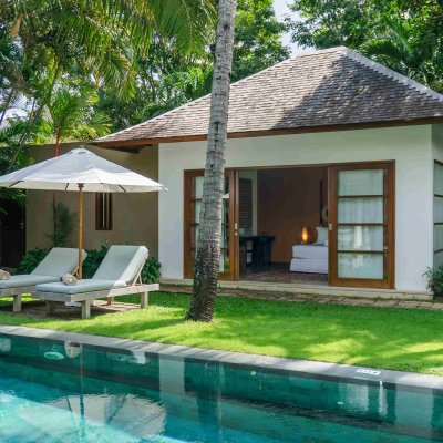Villa Tiga Puluh Villa Tiga Puluh, a modern tropical villa featuring a private pool, open-air living spaces, lush gardens, and Balinese-inspired architecture for a relaxing stay.