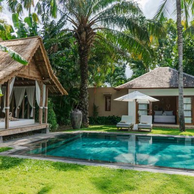Villa Tiga Puluh Villa Tiga Puluh, a modern tropical villa featuring a private pool, open-air living spaces, lush gardens, and Balinese-inspired architecture for a relaxing stay.
