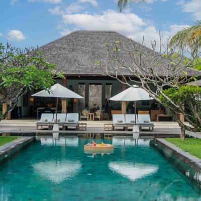 Villa Tiga Puluh Villa Tiga Puluh, a modern tropical villa featuring a private pool, open-air living spaces, lush gardens, and Balinese-inspired architecture for a relaxing stay.