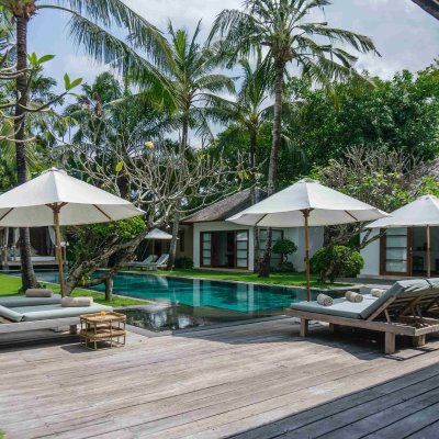Villa Tiga Puluh Villa Tiga Puluh, a modern tropical villa featuring a private pool, open-air living spaces, lush gardens, and Balinese-inspired architecture for a relaxing stay.