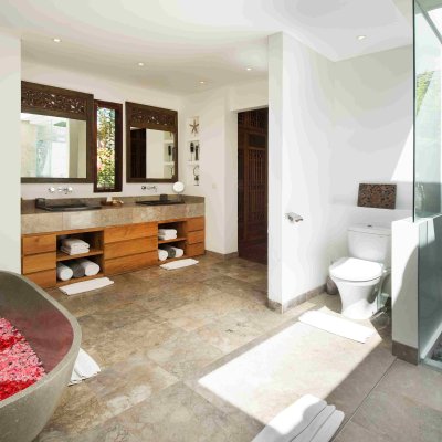 Villa Tiga Puluh Villa Tiga Puluh, a modern tropical villa featuring a private pool, open-air living spaces, lush gardens, and Balinese-inspired architecture for a relaxing stay.