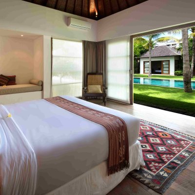 Villa Tiga Puluh Villa Tiga Puluh, a modern tropical villa featuring a private pool, open-air living spaces, lush gardens, and Balinese-inspired architecture for a relaxing stay.