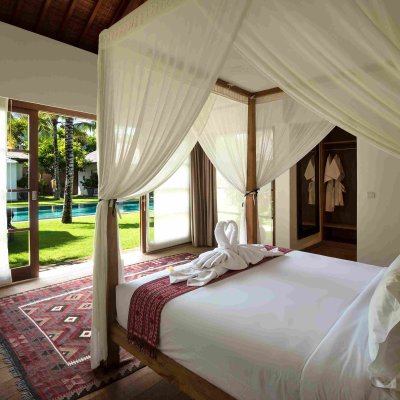 Villa Tiga Puluh Villa Tiga Puluh, a modern tropical villa featuring a private pool, open-air living spaces, lush gardens, and Balinese-inspired architecture for a relaxing stay.