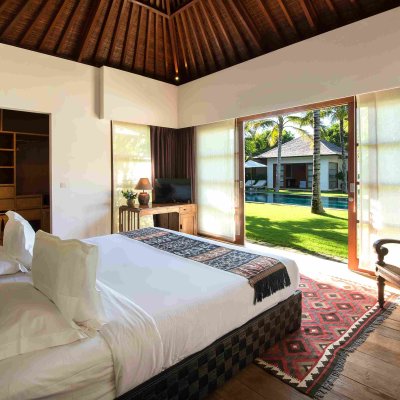 Villa Tiga Puluh Villa Tiga Puluh, a modern tropical villa featuring a private pool, open-air living spaces, lush gardens, and Balinese-inspired architecture for a relaxing stay.