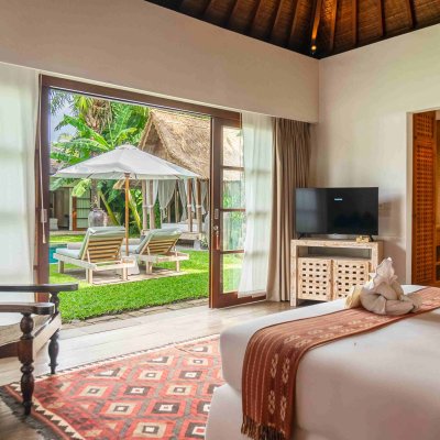 Villa Tiga Puluh Villa Tiga Puluh, a modern tropical villa featuring a private pool, open-air living spaces, lush gardens, and Balinese-inspired architecture for a relaxing stay.