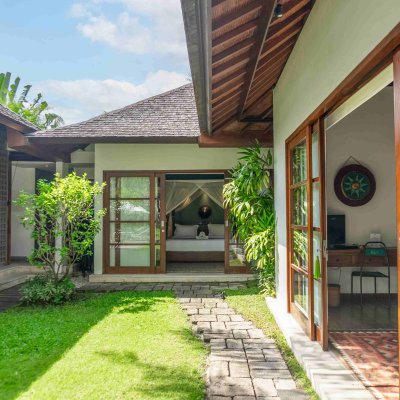 Villa Tiga Puluh Villa Tiga Puluh, a modern tropical villa featuring a private pool, open-air living spaces, lush gardens, and Balinese-inspired architecture for a relaxing stay.