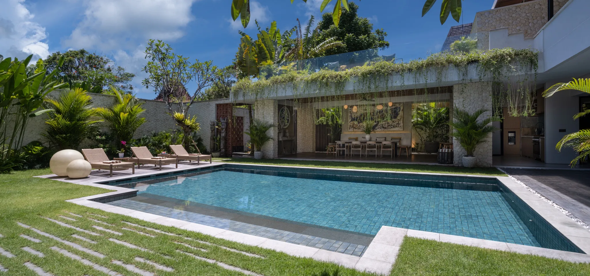 Villa Photo – Villa Pantai Indah – Bali – Indonesia Rooftop deck of Villa Pantai Indah with sun loungers and sunset views in Canggu Bali