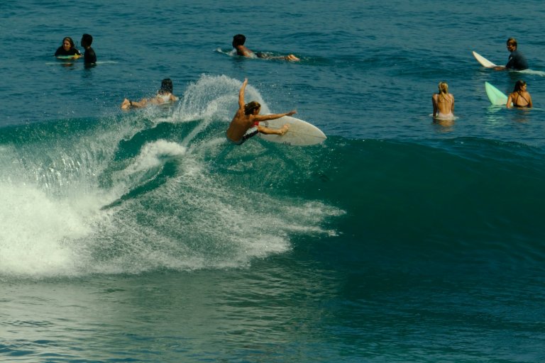 surfing in Bali beach