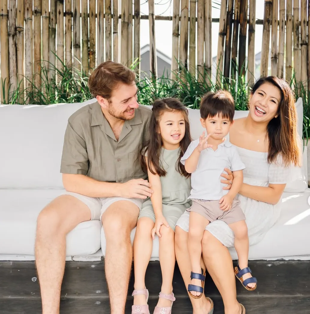 Guests enjoying in-villa activities in a tropical villa, including games, spa treatments, and family-friendly entertainment in a private, relaxing setting.