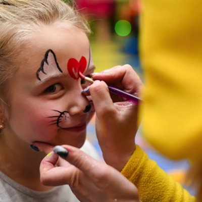 Children enjoying entertainment and activities in a Bali family villa, including games, play areas, and kid-friendly amenities in a safe, tropical environment.
